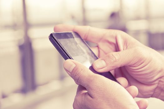 close up image of man checking his phone