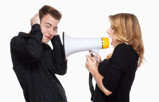 angray girlfriend screaming in megaphone, boyfriend covering his ears