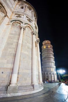 Pisa, Italy - August 11, 2013: Pisa, Piazza del Duomo, with the Basilica leaning tower at dawn, Italy