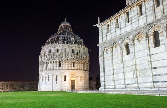 Pisa, Italy - August 11, 2013: Pisa, Piazza del Duomo with Battistero, Basilica and the leaning tower, Italy