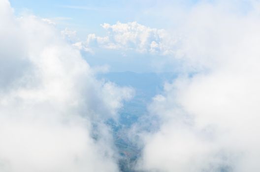 High angle view of the sky surrounded by clouds.
