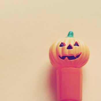 Jack o lantern pumpkin on paper with retro filter effect 