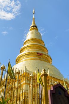 Golden pagoda place for storage relics of the Buddha at Wat Phra That Hariphunchai temple in Lamphun Province Thailand