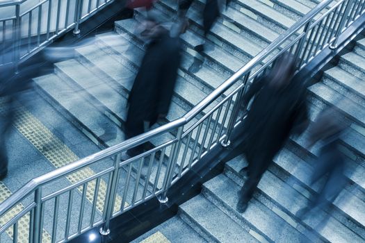people walking on the stair in subway station