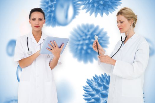 Composite image of female medical team against blue virus cells
