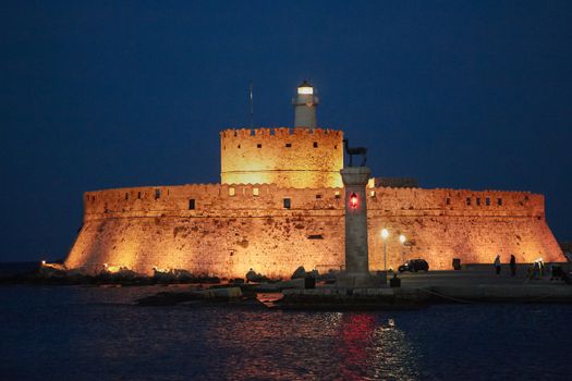 Night shot of Fortress of St Nicholas in the harbor of Rhodes, Greece