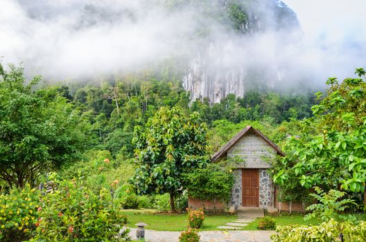 Front home in the morning surrounded by forests and mountains