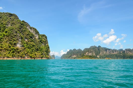 High mountain range above the green lake at Ratchapapha dam in Khao Sok National Park, Surat Thani province, Guilin of Thailand.