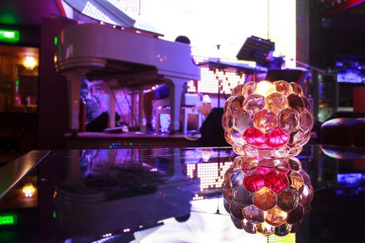 candle in the bar,flashing neon lights