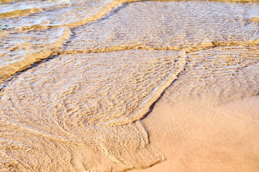 Soft wave of the sea on the clean sandy beach