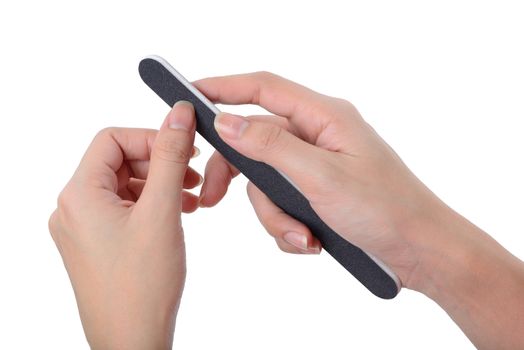 Woman polishing fingernails with nail file, isolated on white