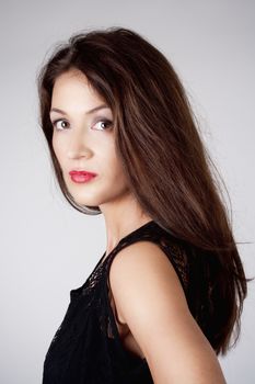 Portrait of a Woman with Brown Hair - Isolated on Gray