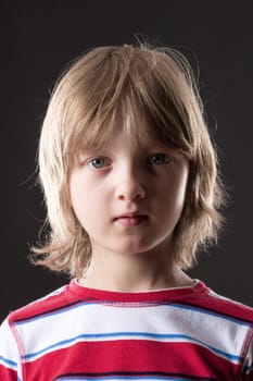 Portrait of a Boy with Blond Hair Looking