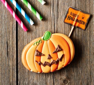 Halloween homemade gingerbread cookie over wooden table