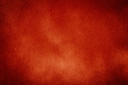 Red texture background with bright center spotlight