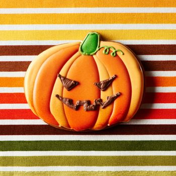 Halloween homemade gingerbread cookie over tablecloth