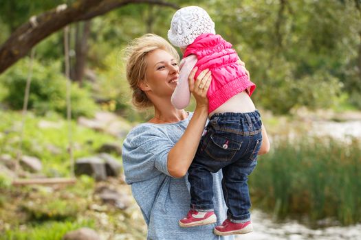 Young mother with adorable daughter