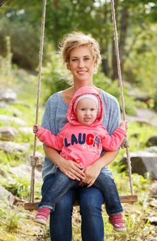 Young mother with adorable daughter