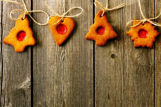 Christmas homemade gingerbread cookies over wooden table