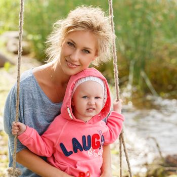 Young mother with adorable daughter