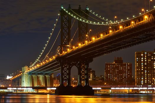 Manhattan Bridge and skyline view from Brooklyn in New York City at night