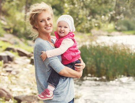 Young mother with adorable daughter