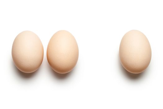 Chicken eggs on white background. Top view