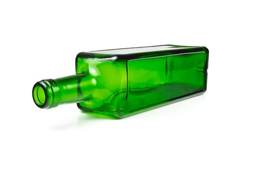 Empty green glass bottle isolated on white background