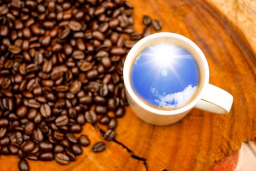 Coffee and beans on the wooden background.