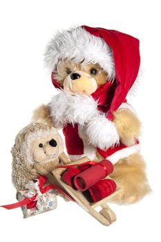 doll with hat of santa claus and gifts