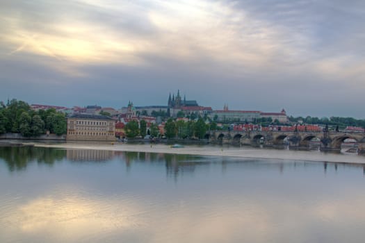 Photo shows general view of Prague castle and Vltava river.