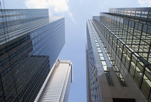 Photo shows the bottom view onto the Toronto skyscapers.