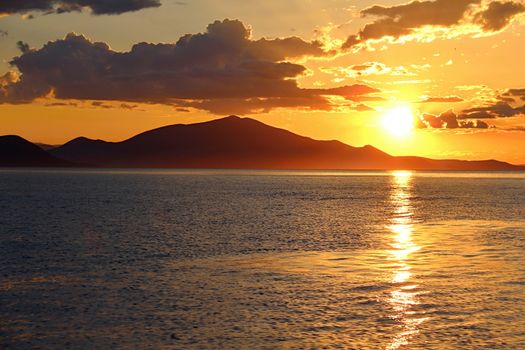 Photo shows Greek sunset over the sea.