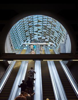 BUDAPEST, HUNGARY - AUGUST 17: Passengers passing by on the escalator  in Budapest, Hungary onAugust 17, 2014