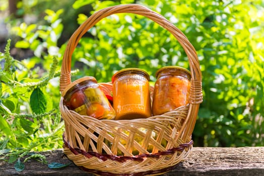 Canned vegetables homemade in a wicker basket