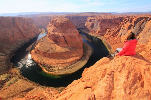 Young woman enjoying view of Horseshoe bend, Arizona