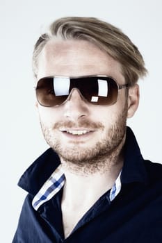 Portrait of a Young Man with Sunglasses - Isolated on Gray