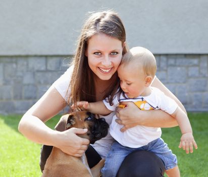 Young Mother with her Baby in the Garden Smiling