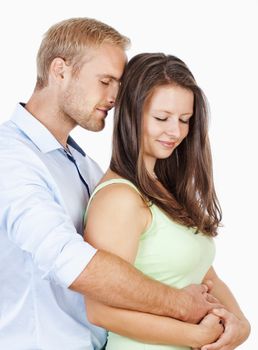 Happy Young Couple Embracing with their Eyes Closed