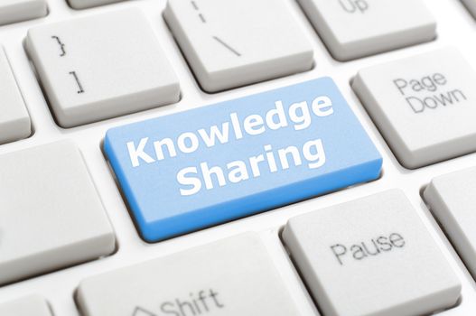 Blue knowledge sharing key on keyboard