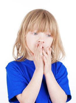 portrait of a boy with long blond hair in blue top - isolated on white