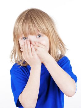 boy with long blond hair suprised, hands on his mouth - isolated on white