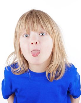 boy with long blond hair sticking out his tongue - isolated on white