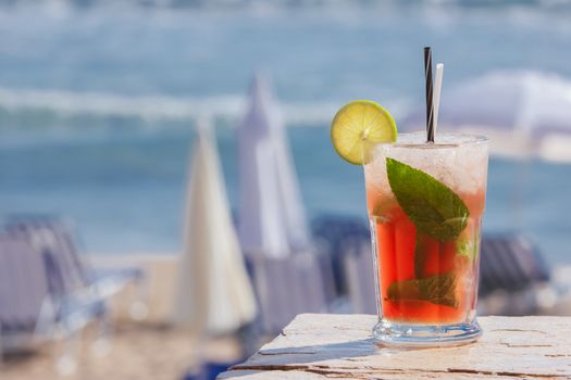 Strawberry cocktail on a beach
