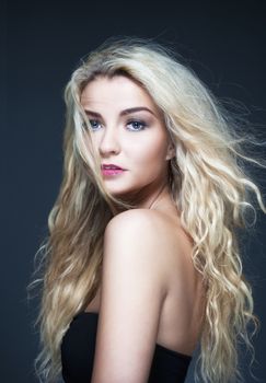 portrait of a young beautiful woman with long blond hair