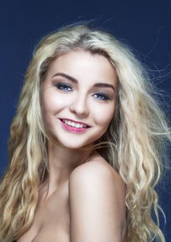 portrait of a young beautiful woman with long blond hair