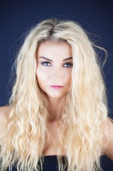 portrait of a young beautiful woman with long blond hair