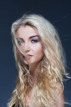 portrait of a young beautiful woman with long blond hair