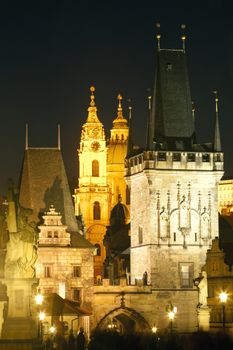 czech republic prague - charles bridge tower and st. nicolas church at dusk