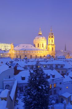 prague - st. nicolas church and rooftops of mala strana in winter